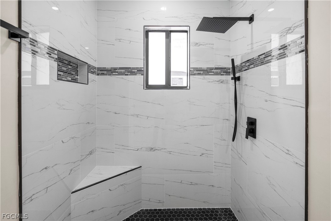 526 Knapp Street Lehigh Acres, FL 33974 - Photo 20 of 37 a bathroom with a shower