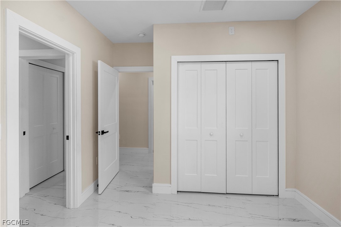 526 Knapp Street Lehigh Acres, FL 33974 - Photo 27 of 37 a view of a livingroom with closet area
