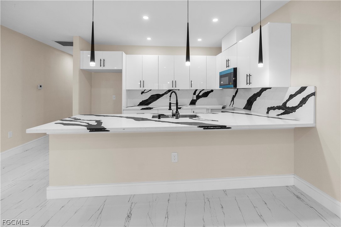 526 Knapp Street Lehigh Acres, FL 33974 - Photo 34 of 37 a view of kitchen with wooden floor