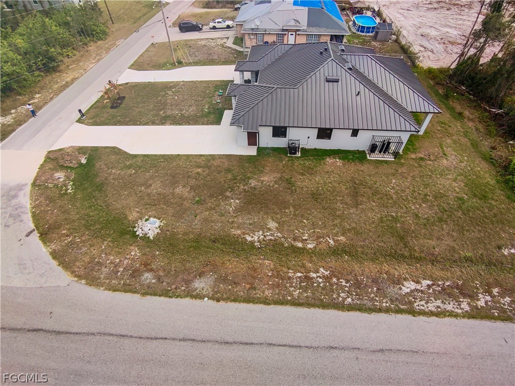 526 Knapp Street Lehigh Acres, FL 33974 - Photo 5 of 37 a view of a back yard of a house