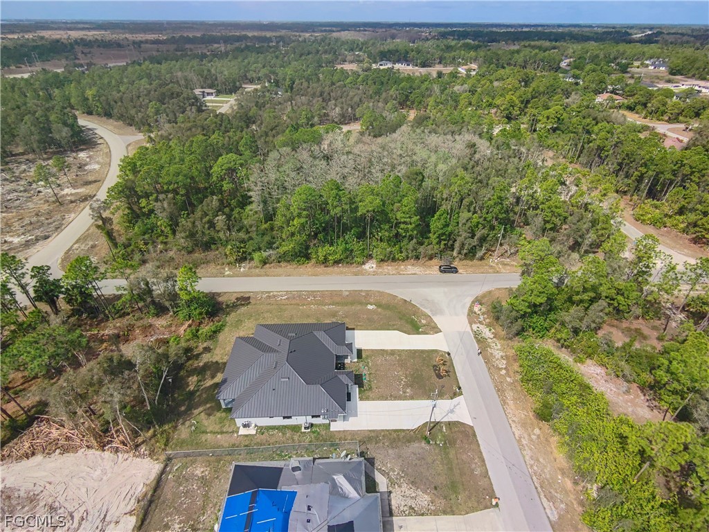 526 Knapp Street Lehigh Acres, FL 33974 - Photo 9 of 37 an aerial view of residential houses with outdoor space