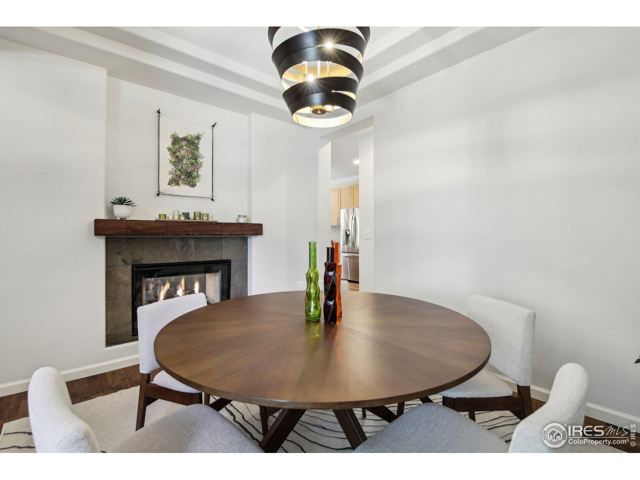 4109 Frederick Circle Longmont, CO 80503 - Photo 13 of 40 a view of a dining room with furniture and chandelier