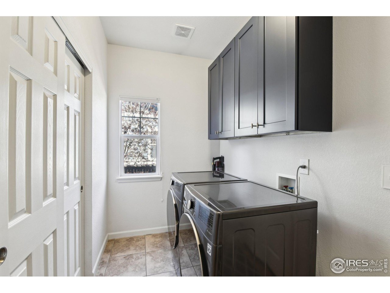 4109 Frederick Circle Longmont, CO 80503 - Photo 16 of 40 a kitchen with a sink cabinets and a window