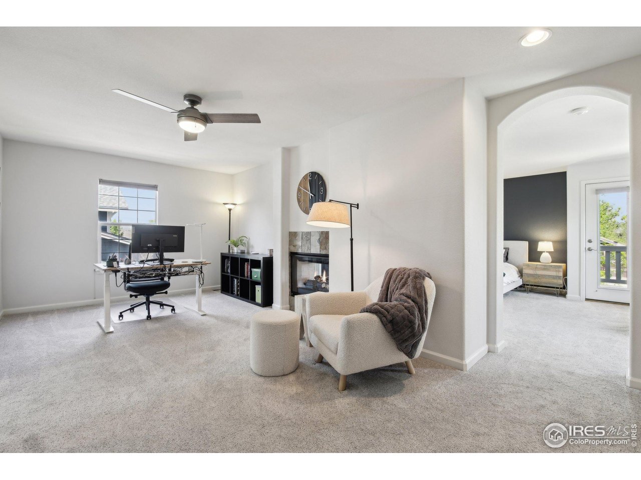 4109 Frederick Circle Longmont, CO 80503 - Photo 17 of 40 a living room with furniture and a fireplace