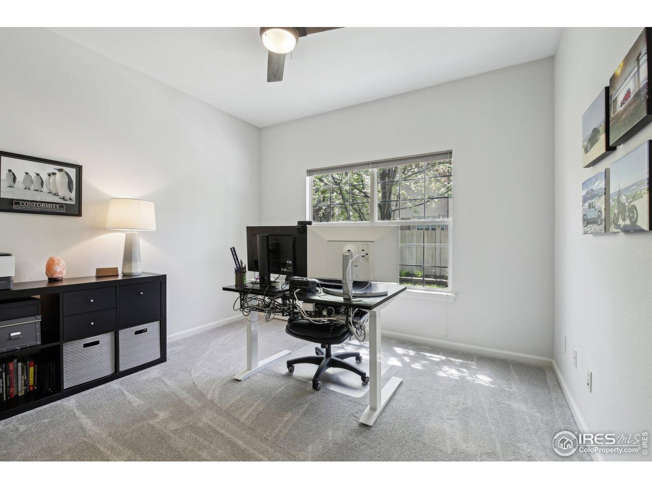 4109 Frederick Circle Longmont, CO 80503 - Photo 18 of 40 a workspace with a computer on the desk and a chair