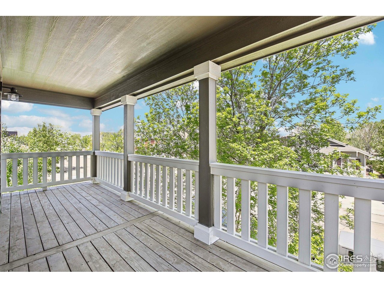 4109 Frederick Circle Longmont, CO 80503 - Photo 21 of 40 a view of balcony with wooden floor