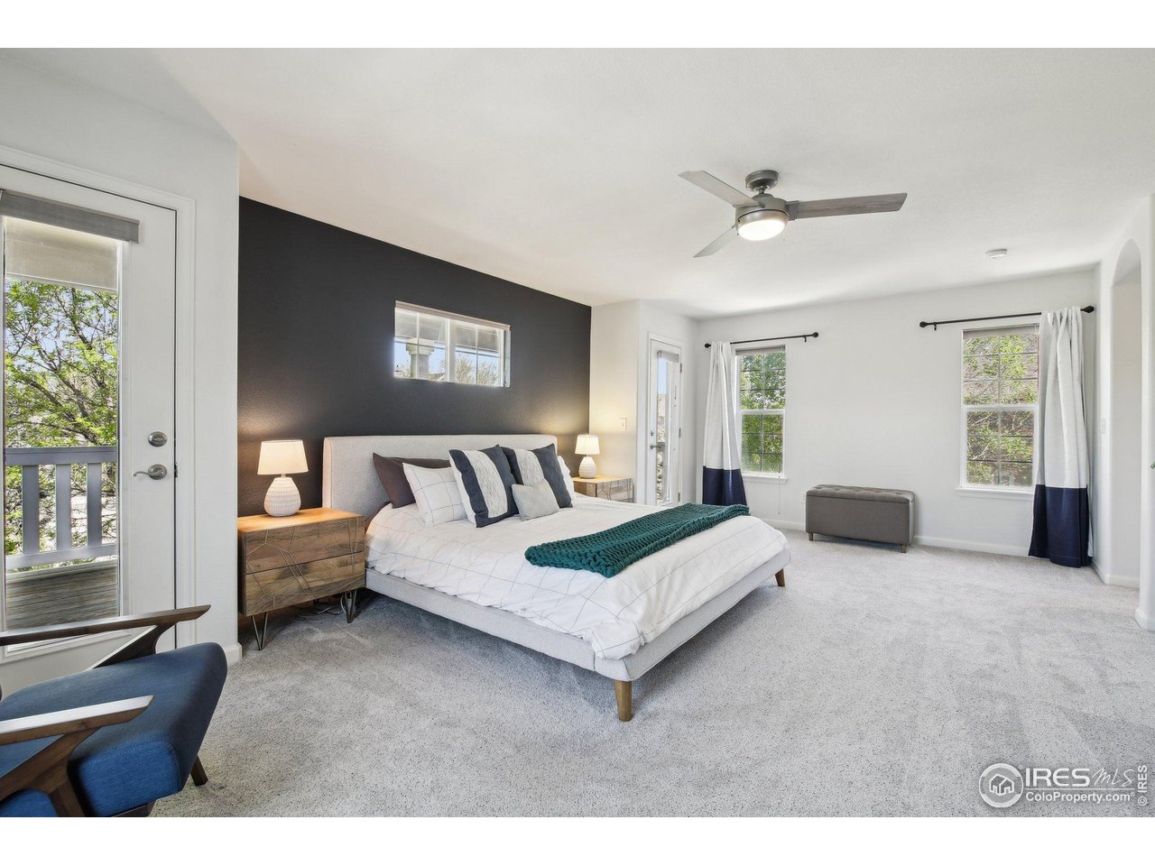 4109 Frederick Circle Longmont, CO 80503 - Photo 22 of 40 a spacious bedroom with a bed couch and a window