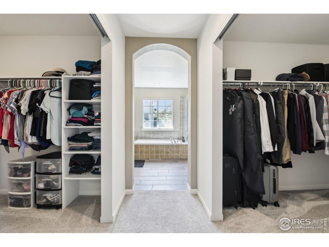 4109 Frederick Circle Longmont, CO 80503 - Photo 24 of 40 a view of walk in closet with clothes and shoes