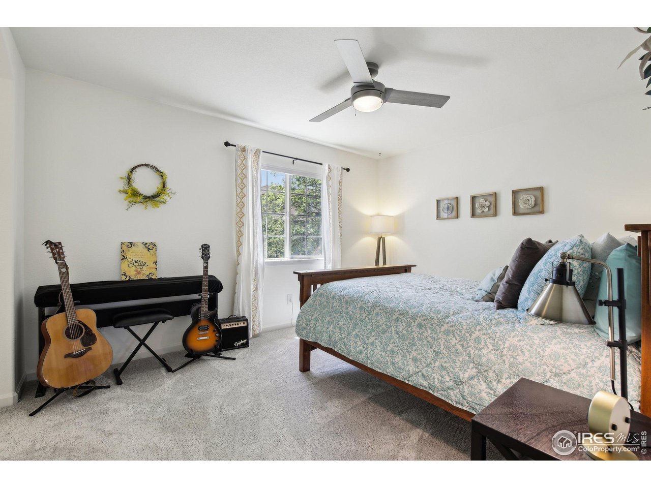 4109 Frederick Circle Longmont, CO 80503 - Photo 27 of 40 a bedroom with bed and window