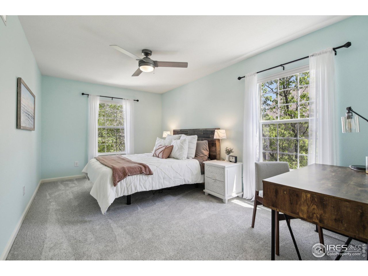 4109 Frederick Circle Longmont, CO 80503 - Photo 28 of 40 a bedroom with a bed and a table