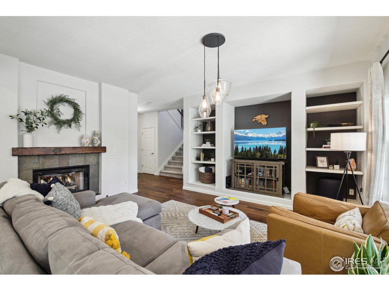 4109 Frederick Circle Longmont, CO 80503 - Photo 3 of 40 a living room with furniture and a wooden floor