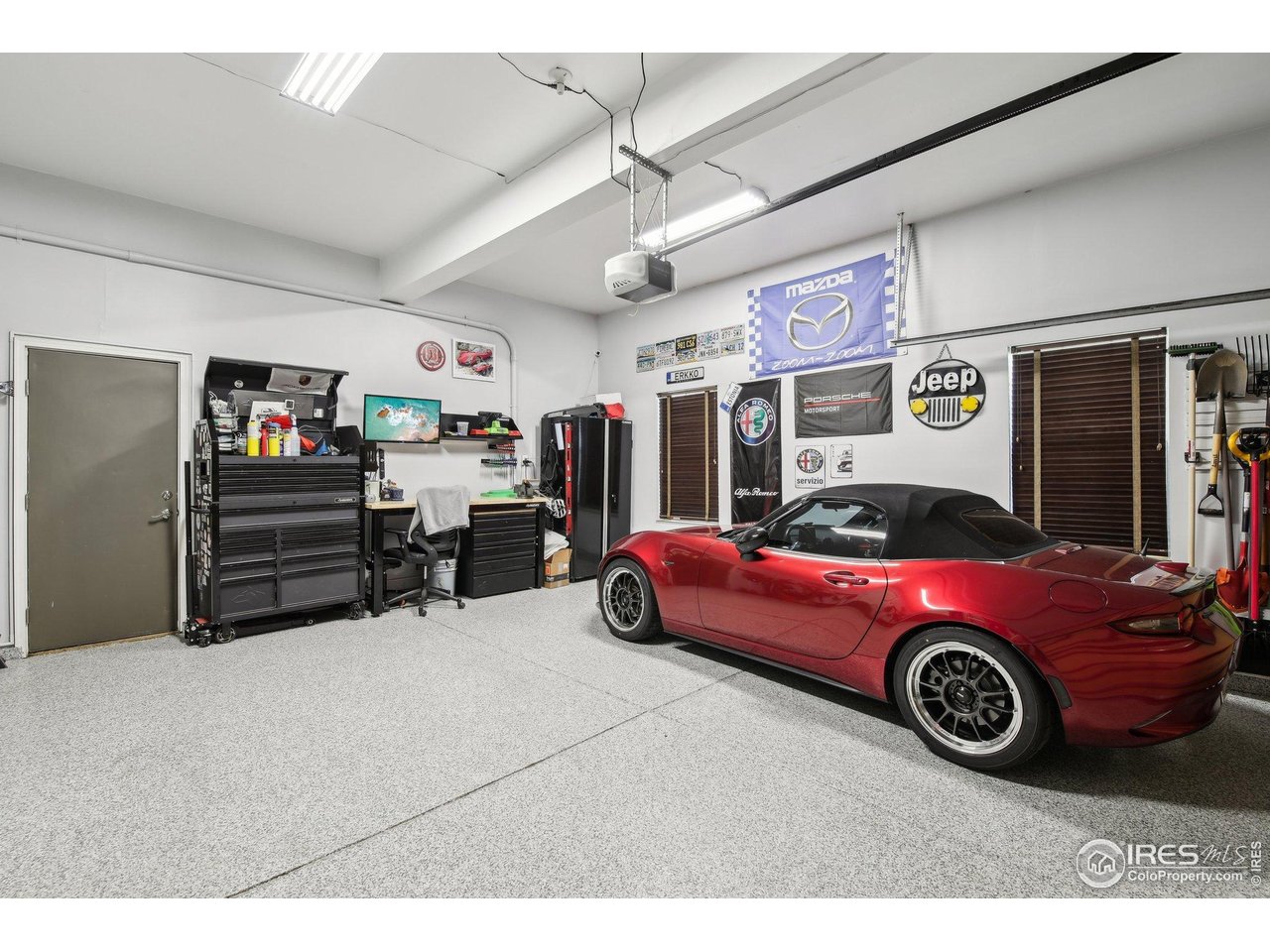 4109 Frederick Circle Longmont, CO 80503 - Photo 32 of 40 a car is parked in a garage