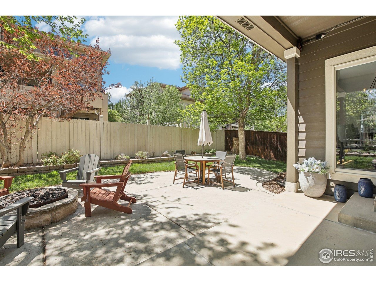 4109 Frederick Circle Longmont, CO 80503 - Photo 34 of 40 a view of a backyard with sitting area and furniture
