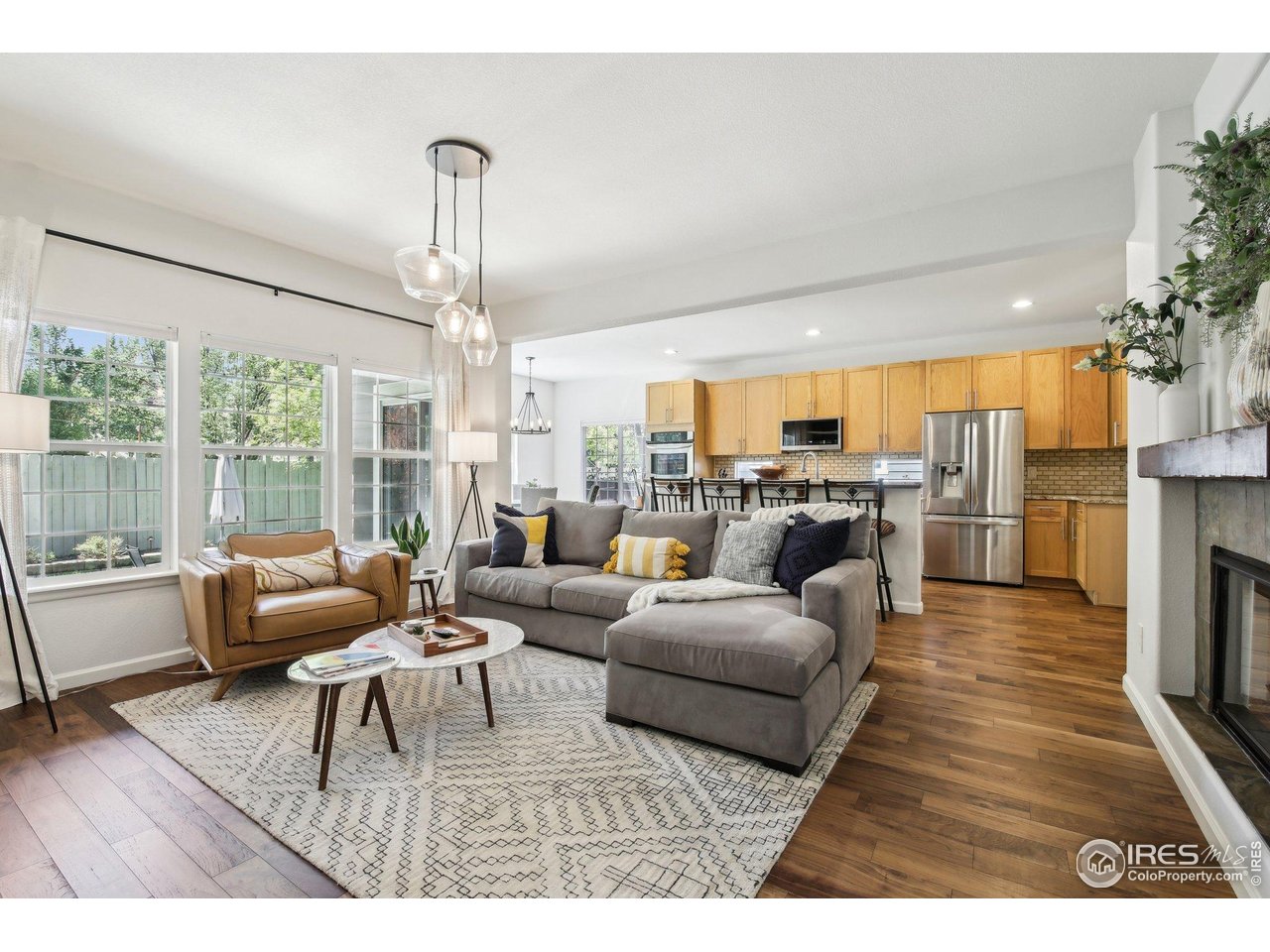 4109 Frederick Circle Longmont, CO 80503 - Photo 5 of 40 a living room with furniture large window and wooden floor