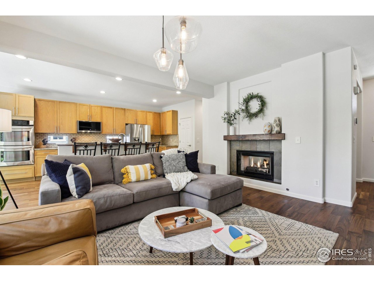 4109 Frederick Circle Longmont, CO 80503 - Photo 6 of 40 a living room with furniture and a fireplace
