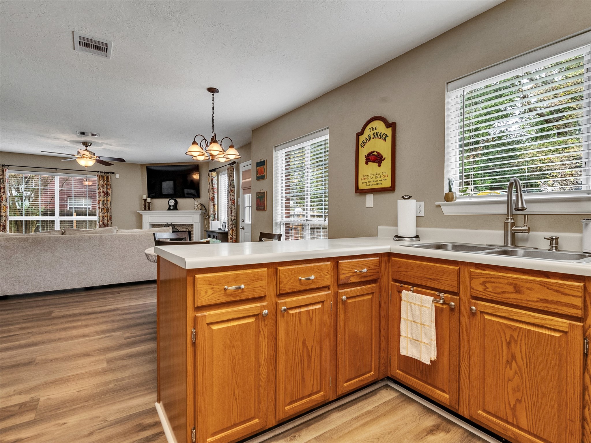 14219 Whitlock Drive Houston, TX 77062 - Photo 17 of 49 a kitchen with stainless steel appliances granite countertop a sink dishwasher a stove and a refrigerator with wooden floor