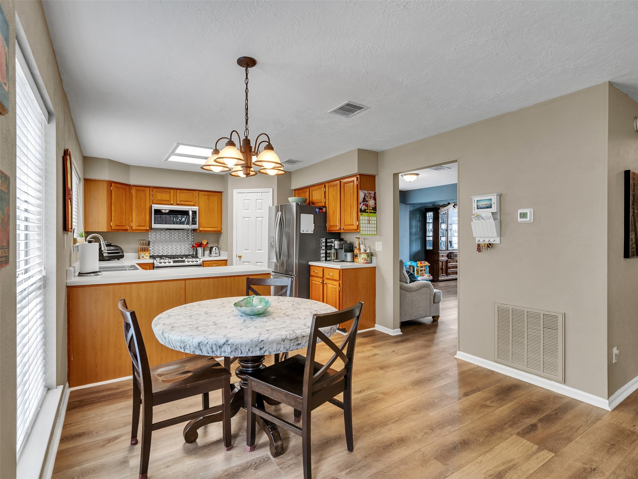14219 Whitlock Drive Houston, TX 77062 - Photo 20 of 49 a view of a dining room with furniture window and wooden floor