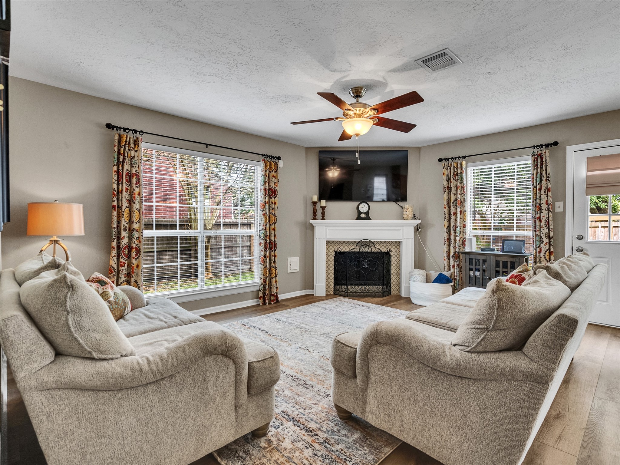 14219 Whitlock Drive Houston, TX 77062 - Photo 22 of 49 a living room with furniture a fireplace and a large window