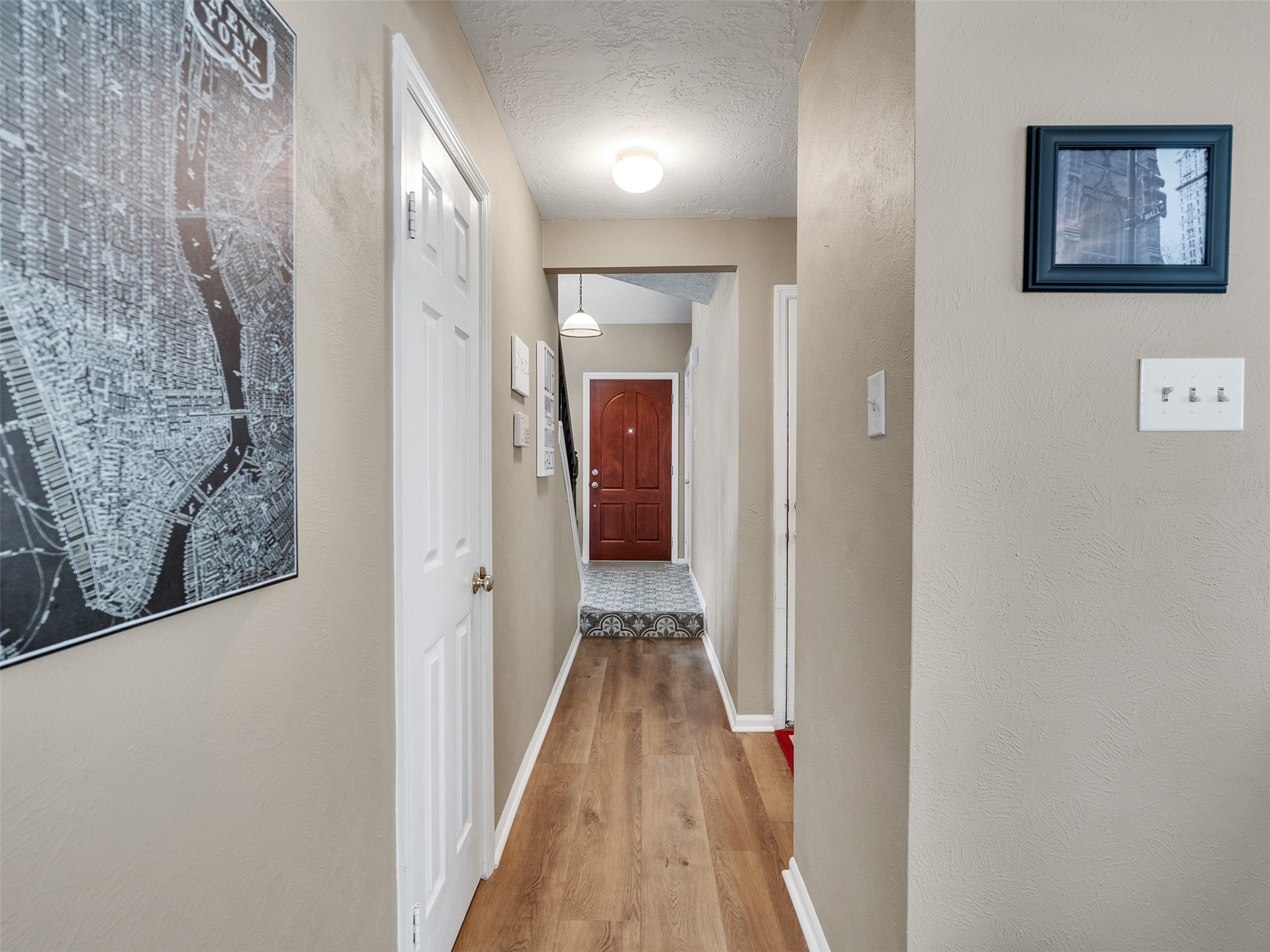 14219 Whitlock Drive Houston, TX 77062 - Photo 26 of 49 a view of a hallway with wooden floor and staircase