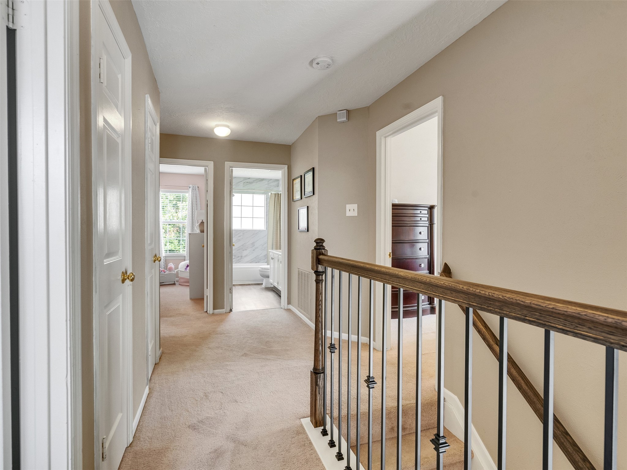 14219 Whitlock Drive Houston, TX 77062 - Photo 28 of 49 a view of a hallway with wooden floor and stairs
