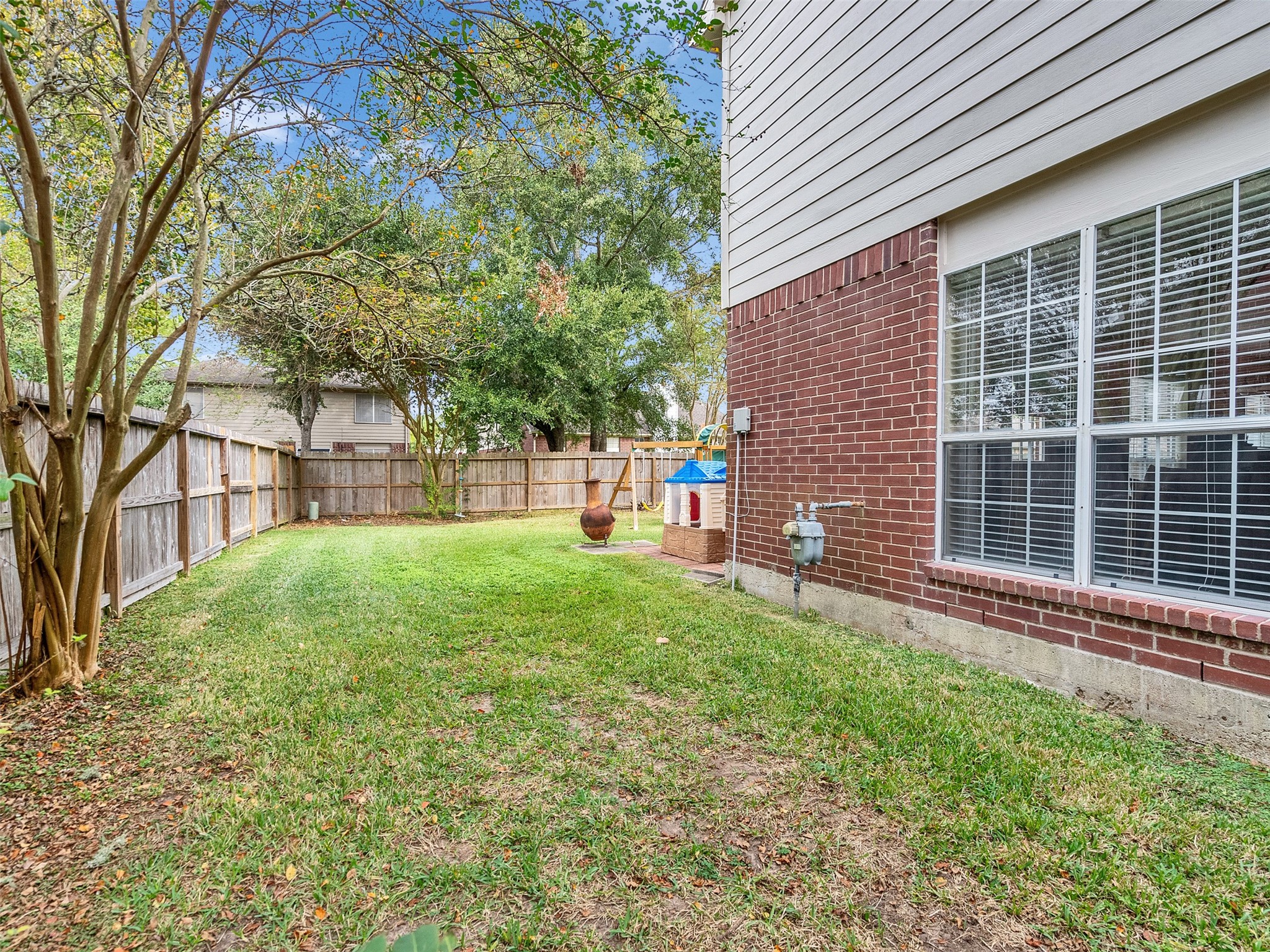 14219 Whitlock Drive Houston, TX 77062 - Photo 48 of 49 a view of a backyard with a large tree