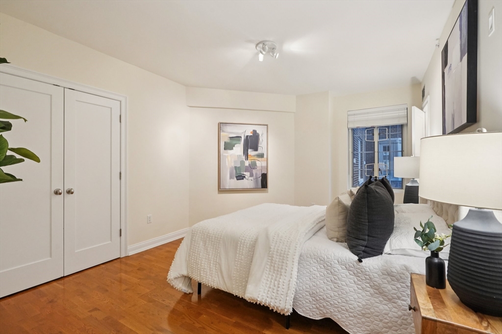 20 Chapel Street, Unit B811 Brookline, MA 02446 - Photo 16 of 33 a bedroom with a bed and window