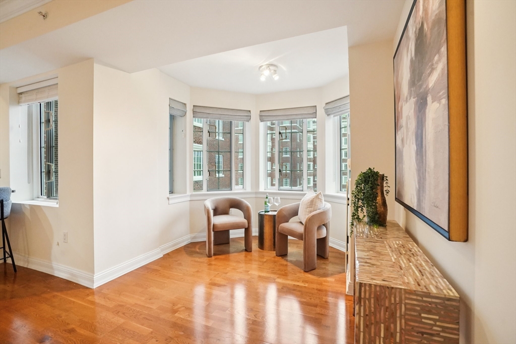 20 Chapel Street, Unit B811 Brookline, MA 02446 - Photo 24 of 33 a view of a livingroom with furniture window and wooden floor