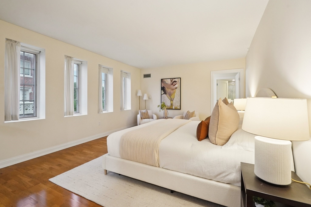 20 Chapel Street, Unit B811 Brookline, MA 02446 - Photo 26 of 33 a bedroom with a bed and window