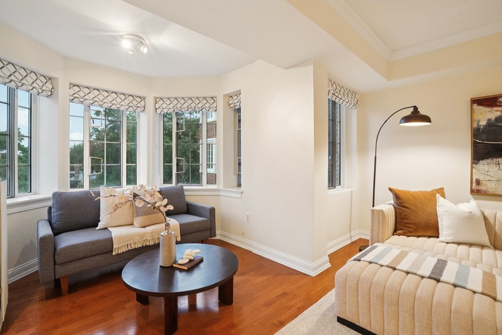 20 Chapel Street, Unit B811 Brookline, MA 02446 - Photo 5 of 33 a bedroom with a bed and a couch