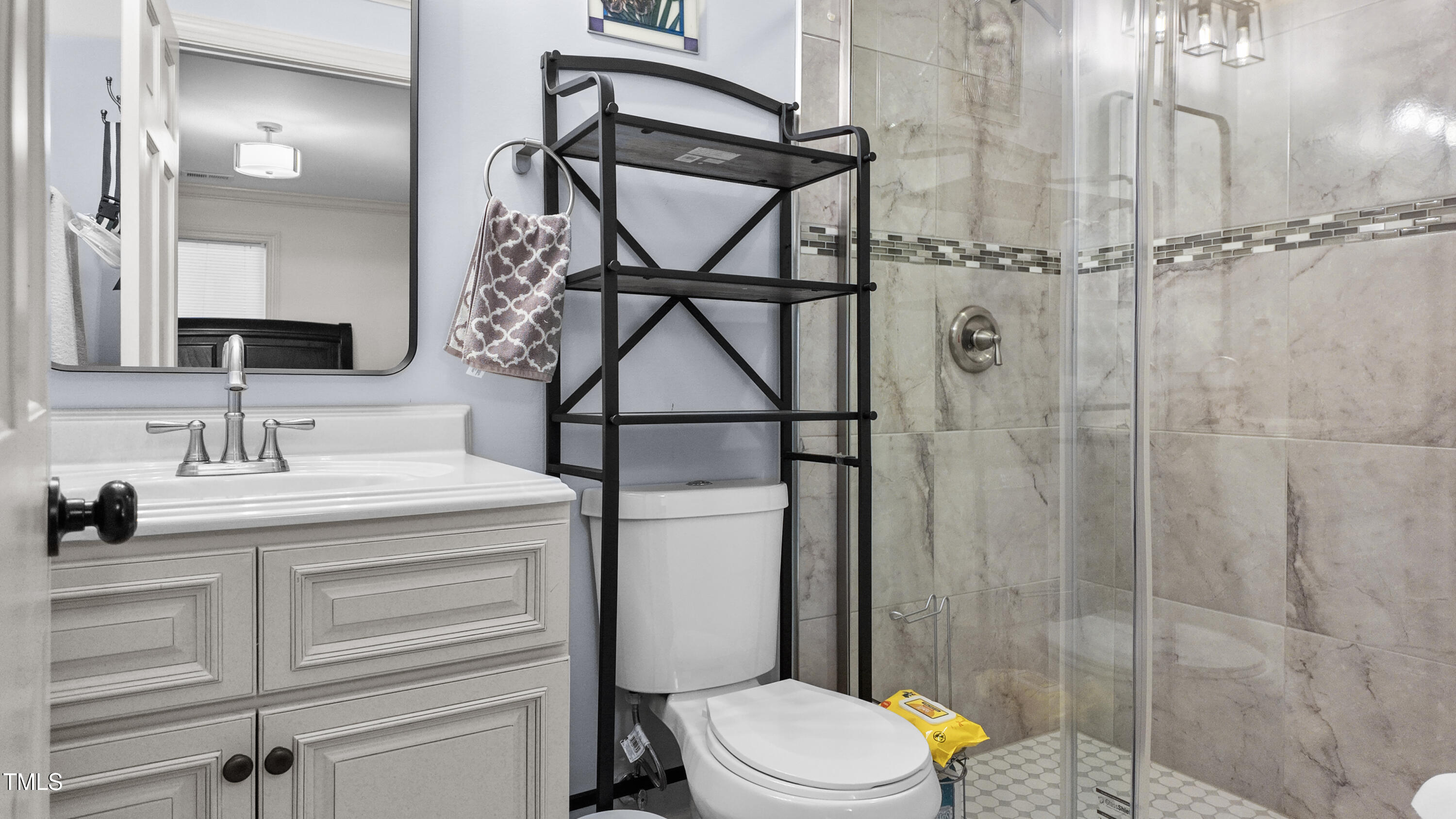 304 Spring Street Durham, NC 27703 - Photo 13 of 28 Updated bathrooms are a testament to modern elegance, boasting contemporary finishes and luxurious walk-in showers