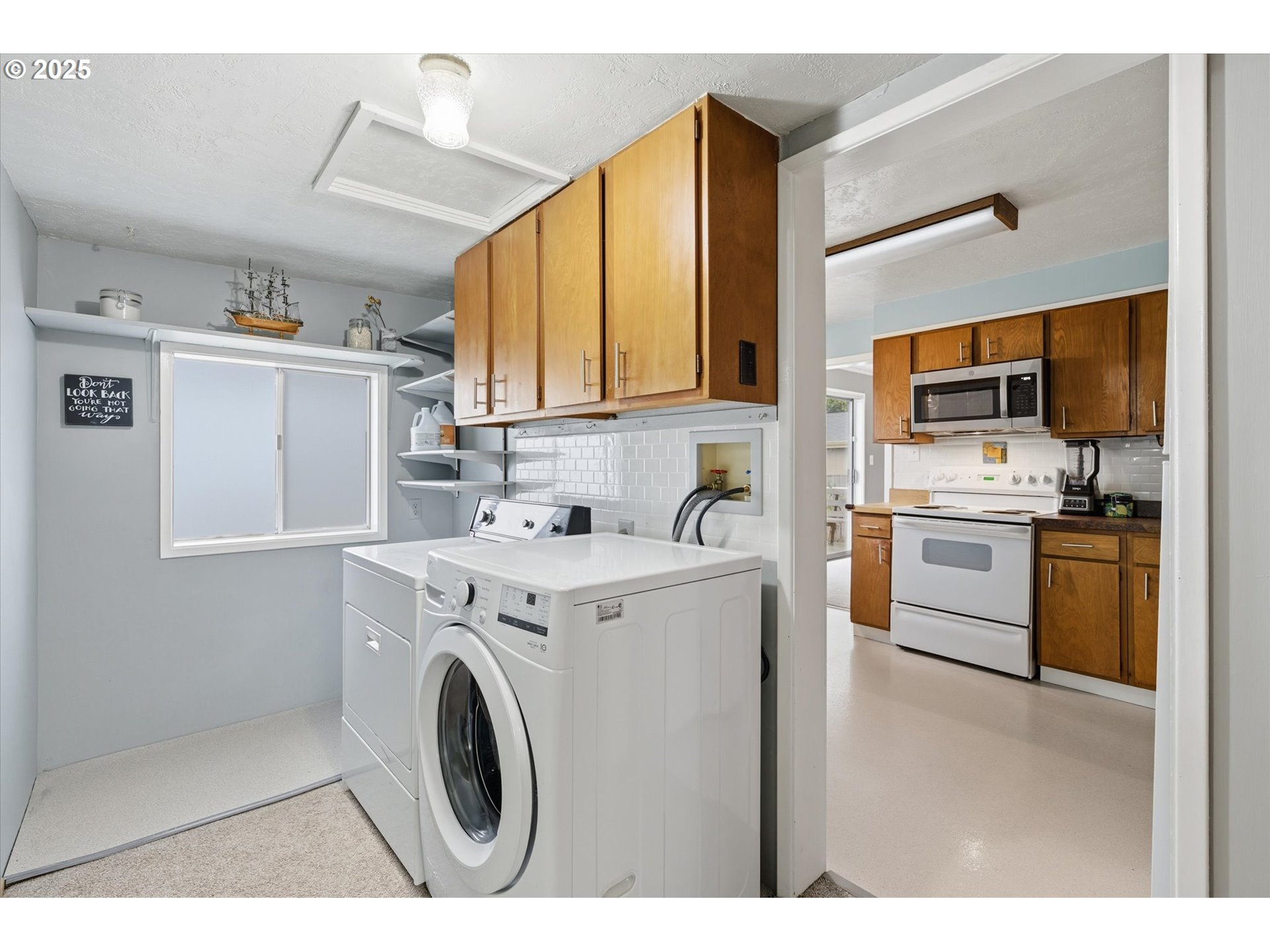 4514 L Place Seaview, WA 98644 - Photo 12 of 47 a kitchen with a stove a sink and a refrigerator