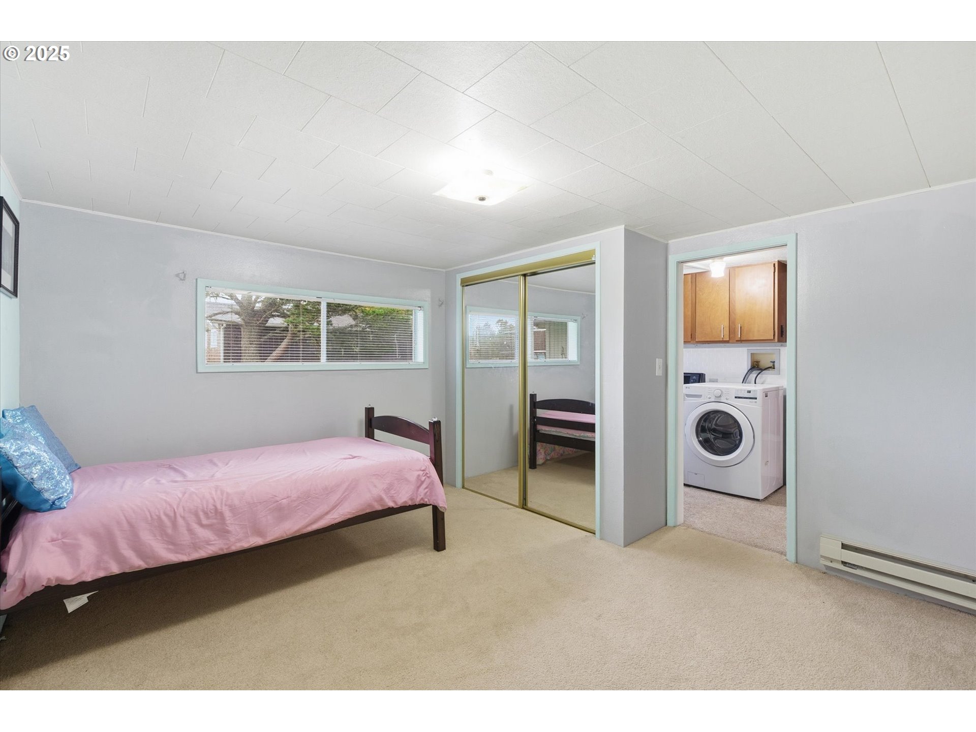 4514 L Place Seaview, WA 98644 - Photo 14 of 47 a bedroom with a bed and a window