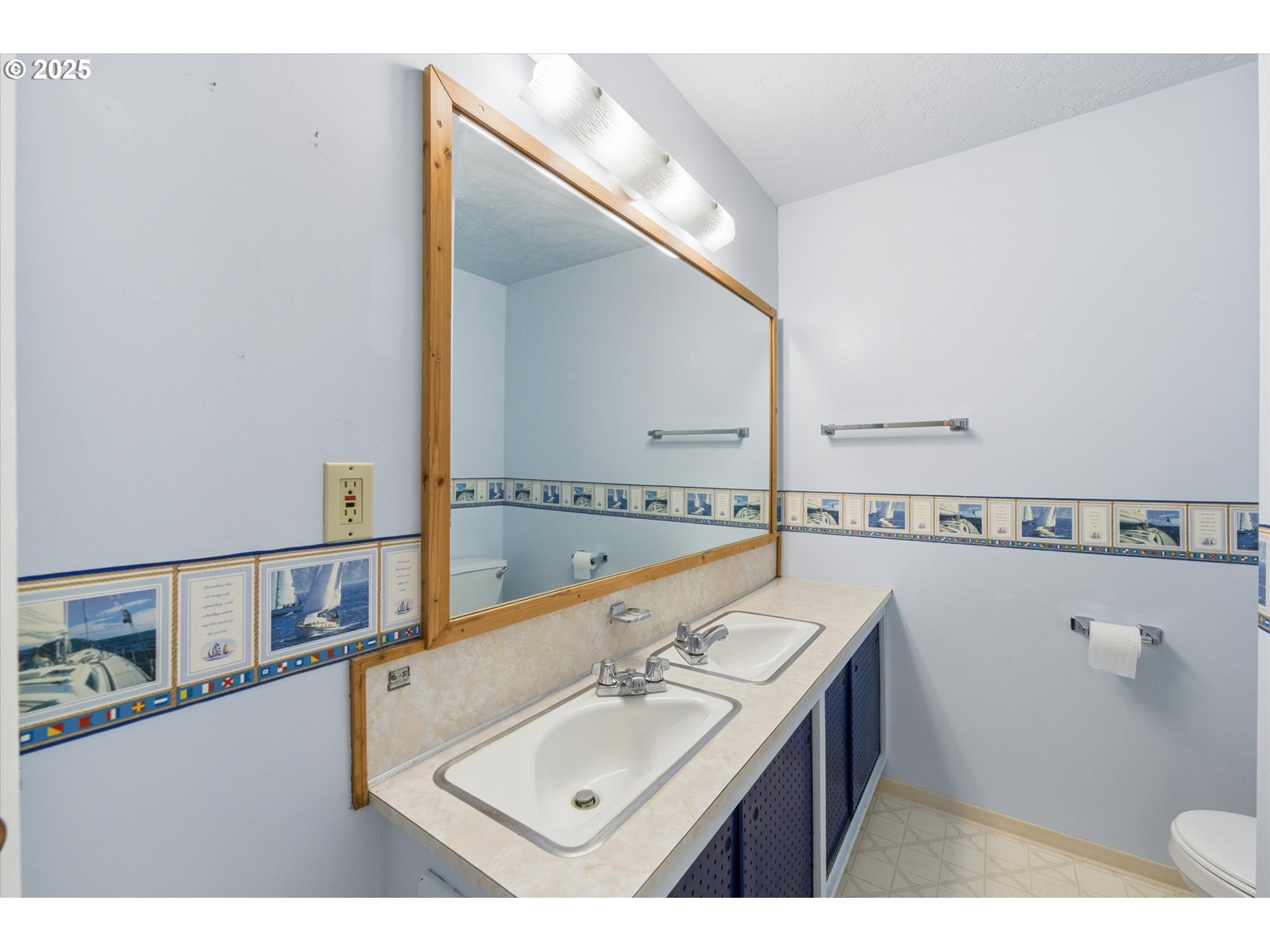 4514 L Place Seaview, WA 98644 - Photo 21 of 47 a bathroom with a sink and a mirror