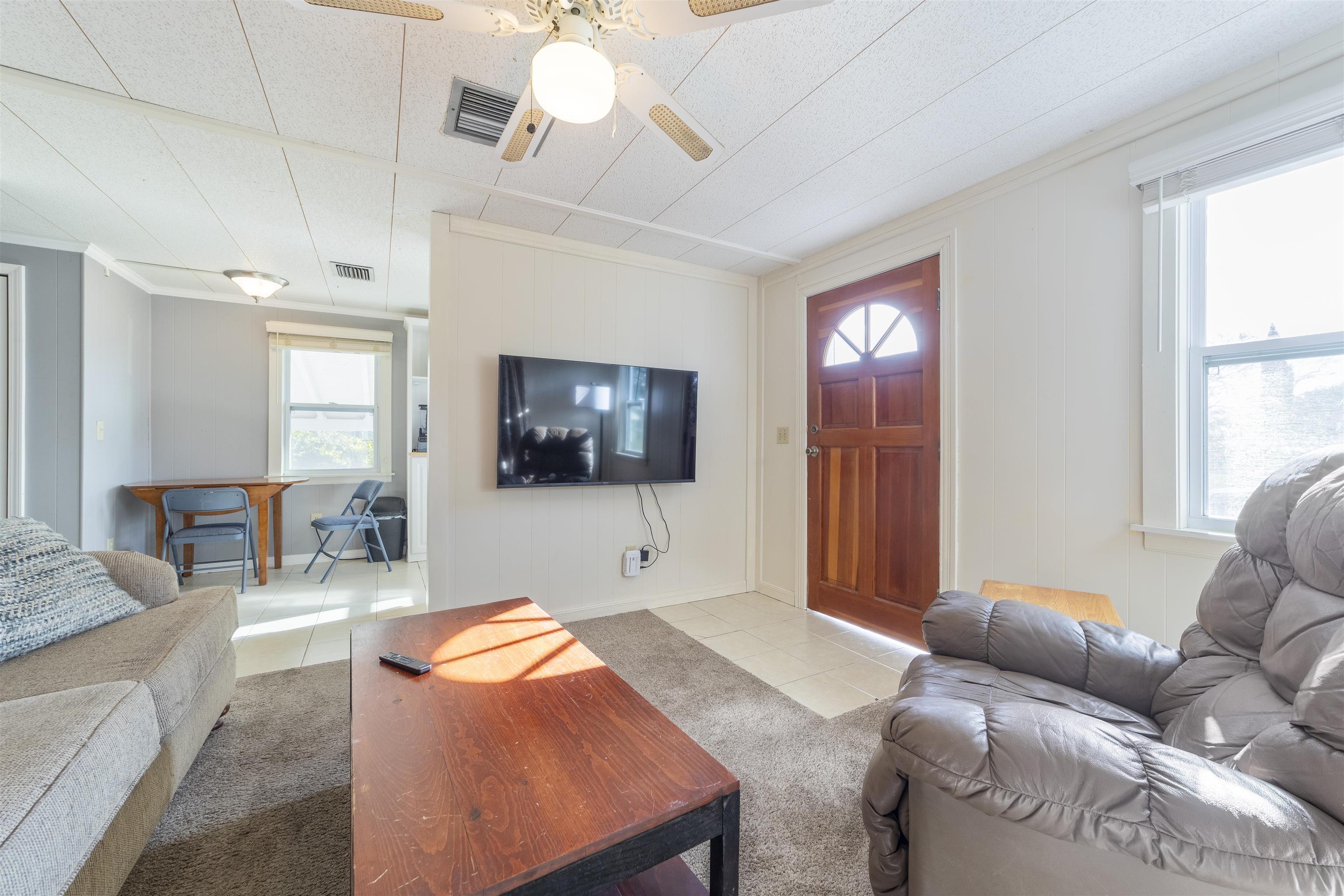 882 Palermo Road St. Augustine, FL 32086 - Photo 11 of 26 a living room with furniture and a flat screen tv