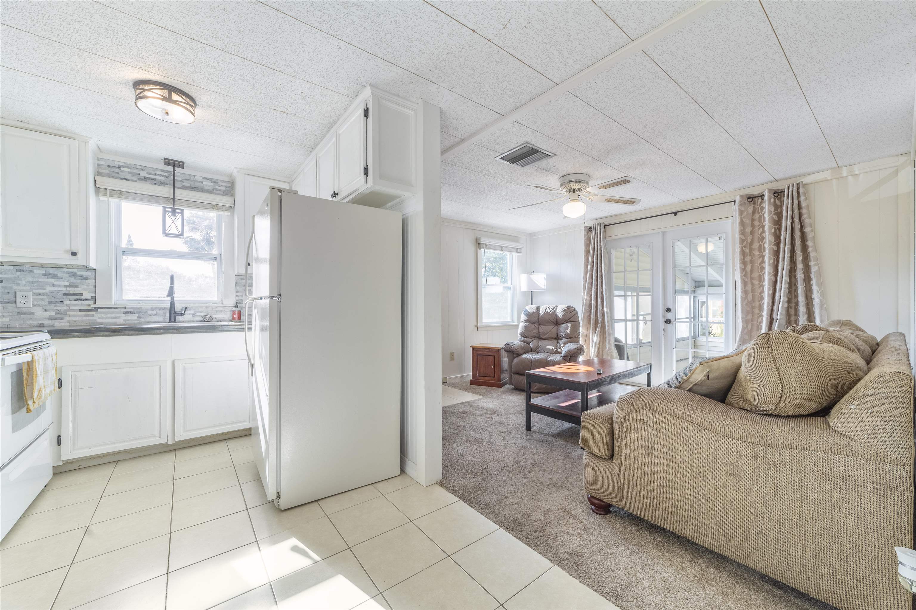 882 Palermo Road St. Augustine, FL 32086 - Photo 12 of 26 a living room with furniture and a open kitchen view