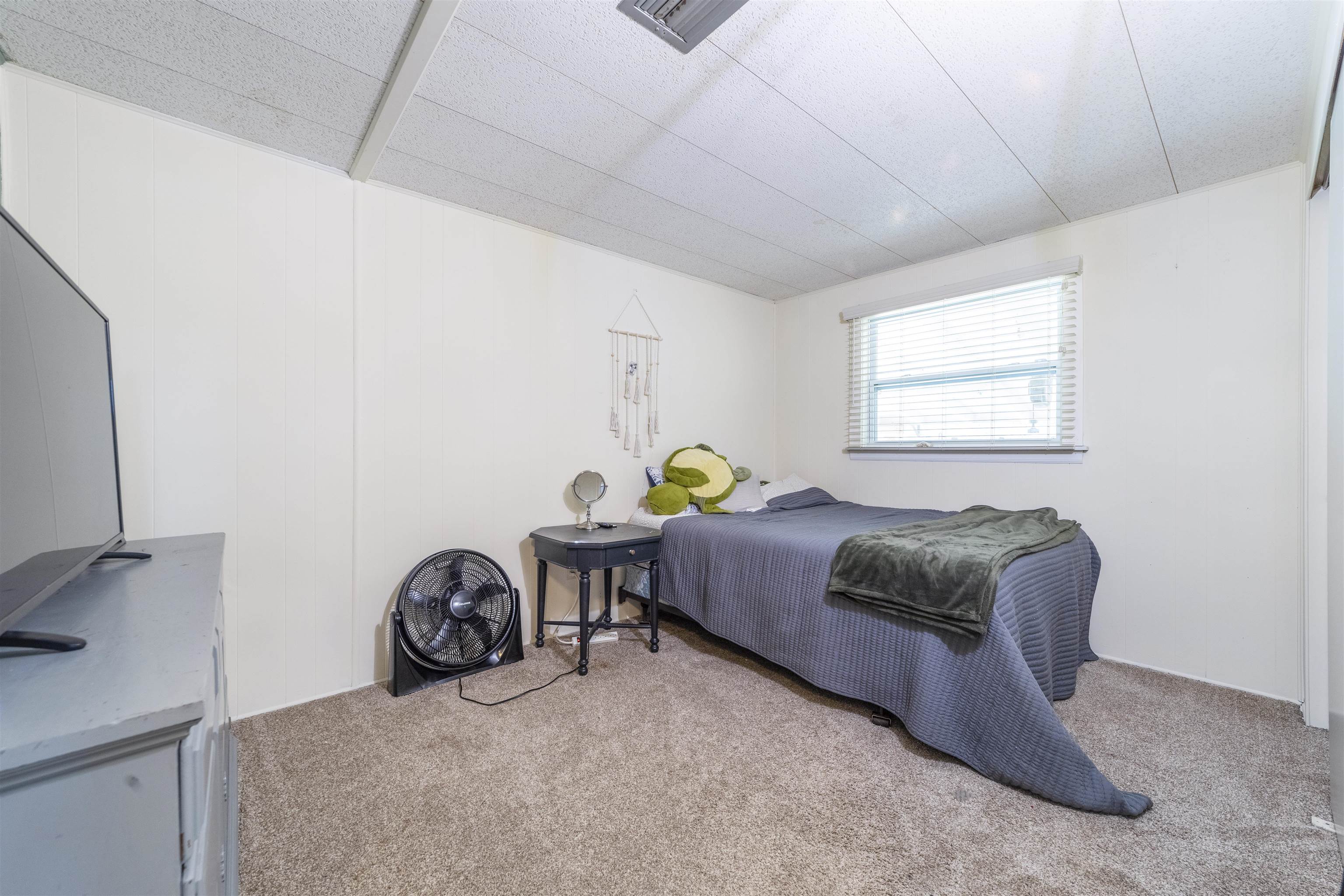 882 Palermo Road St. Augustine, FL 32086 - Photo 19 of 26 a bedroom with bed and a window