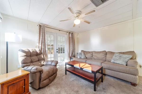 a living room with a couch and a large window