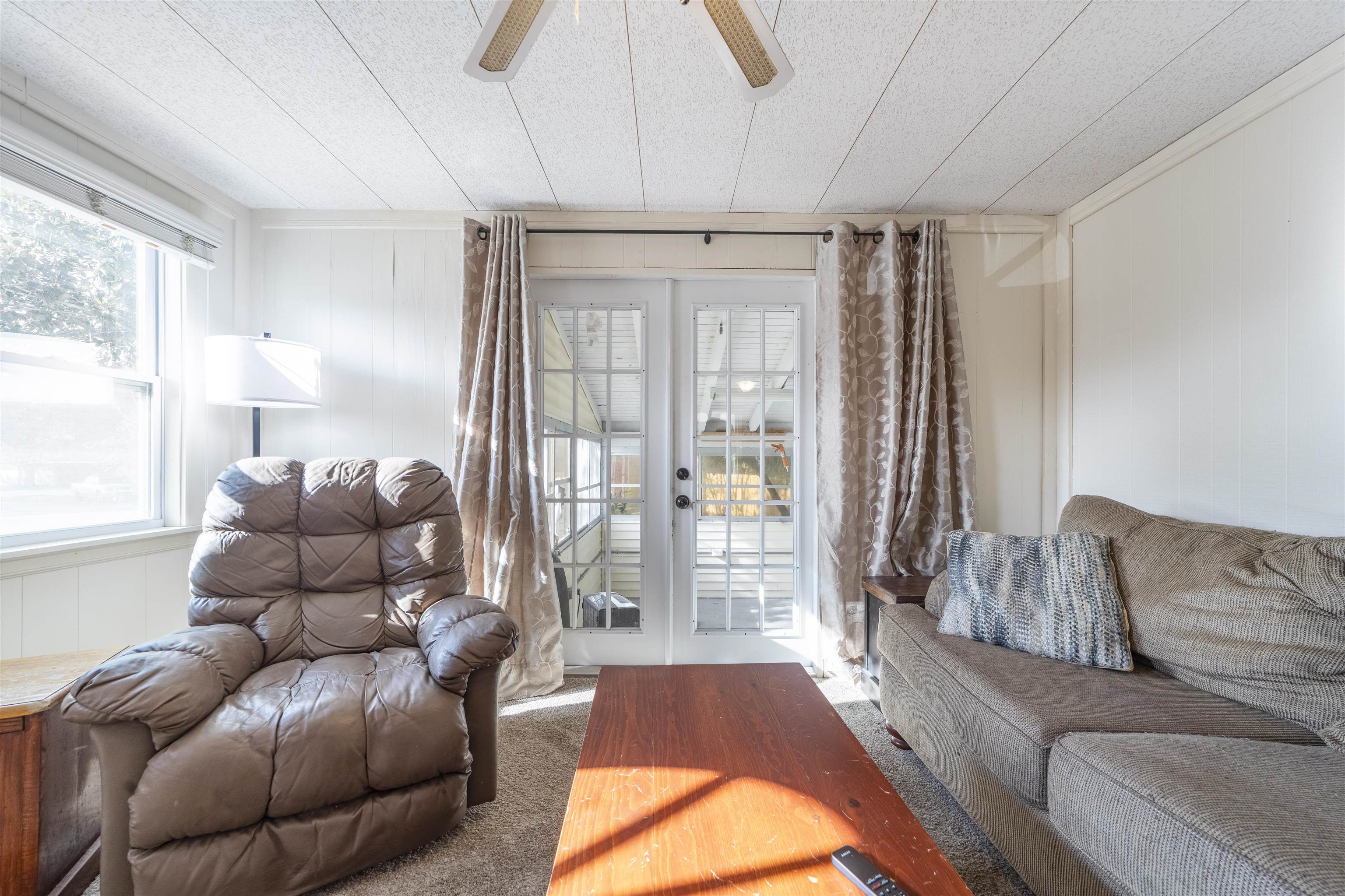 882 Palermo Road St. Augustine, FL 32086 - Photo 9 of 26 a living room with a couch and a large window