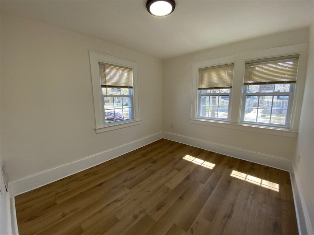 31 Freeman Terrace Springfield, MA 01104 - Photo 15 of 28 a view of an empty room with wooden floor and a window