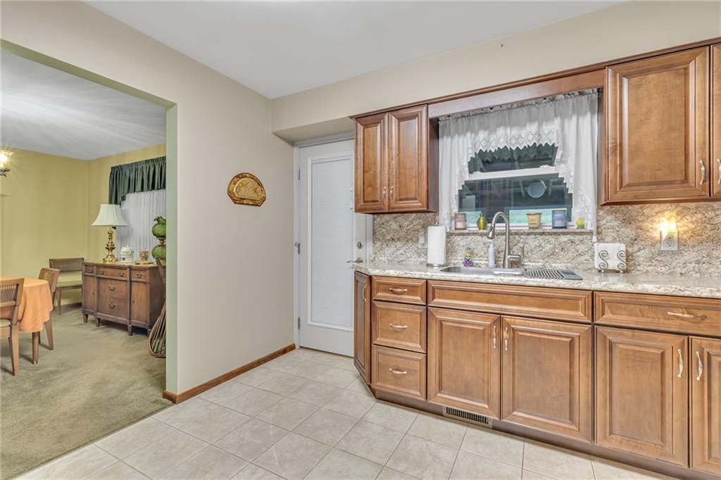 610 Davidson Drive Rochester, PA 15074 - Photo 11 of 30 a kitchen with white cabinets and window