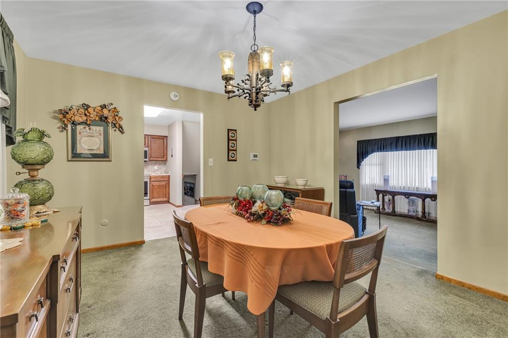 610 Davidson Drive Rochester, PA 15074 - Photo 13 of 30 a dining room with furniture a chandelier and wooden floor