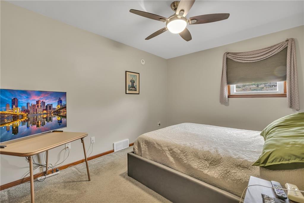 610 Davidson Drive Rochester, PA 15074 - Photo 14 of 30 a bedroom with a bed and painting on the wall