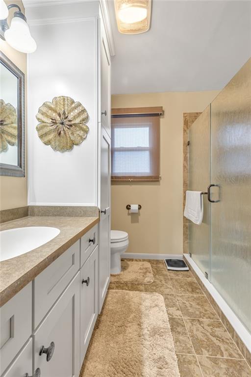 610 Davidson Drive Rochester, PA 15074 - Photo 21 of 30 a spacious bathroom with a granite countertop sink a toilet a mirror and shower