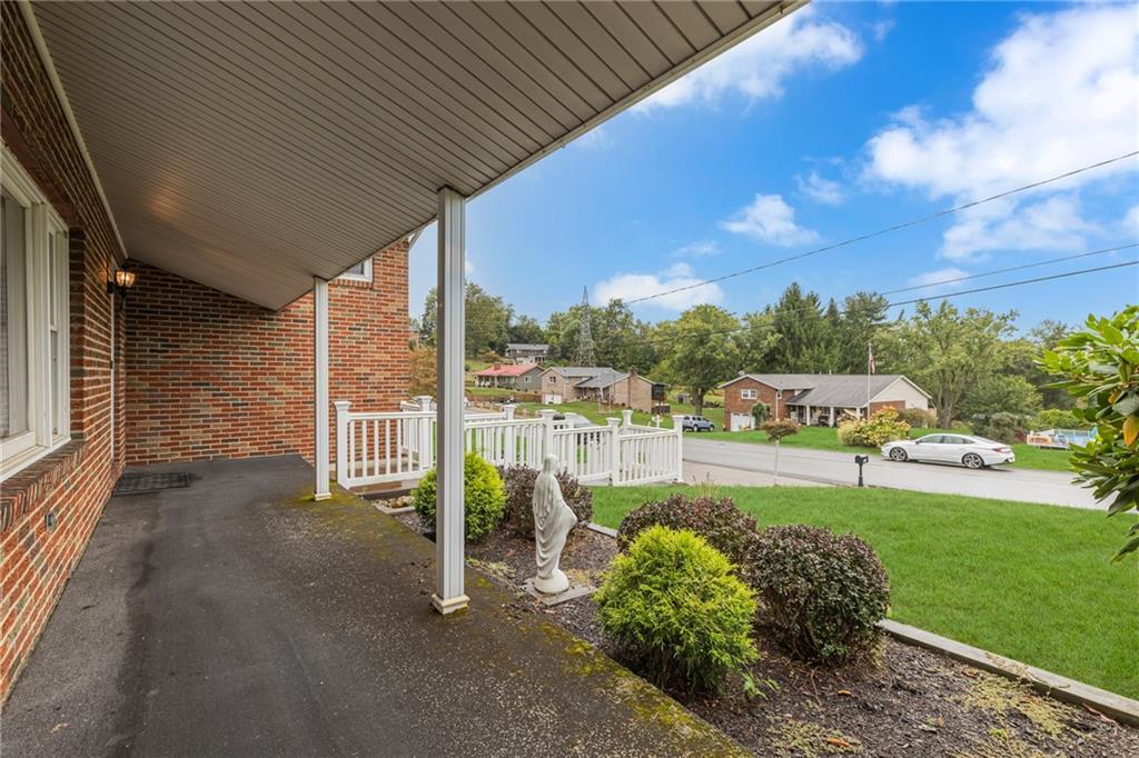 610 Davidson Drive Rochester, PA 15074 - Photo 3 of 30 a view of a patio with table and chairs plants and large trees