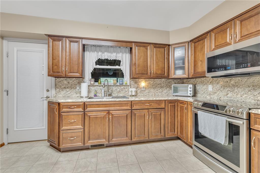 610 Davidson Drive Rochester, PA 15074 - Photo 9 of 30 a kitchen with cabinets appliances and a sink