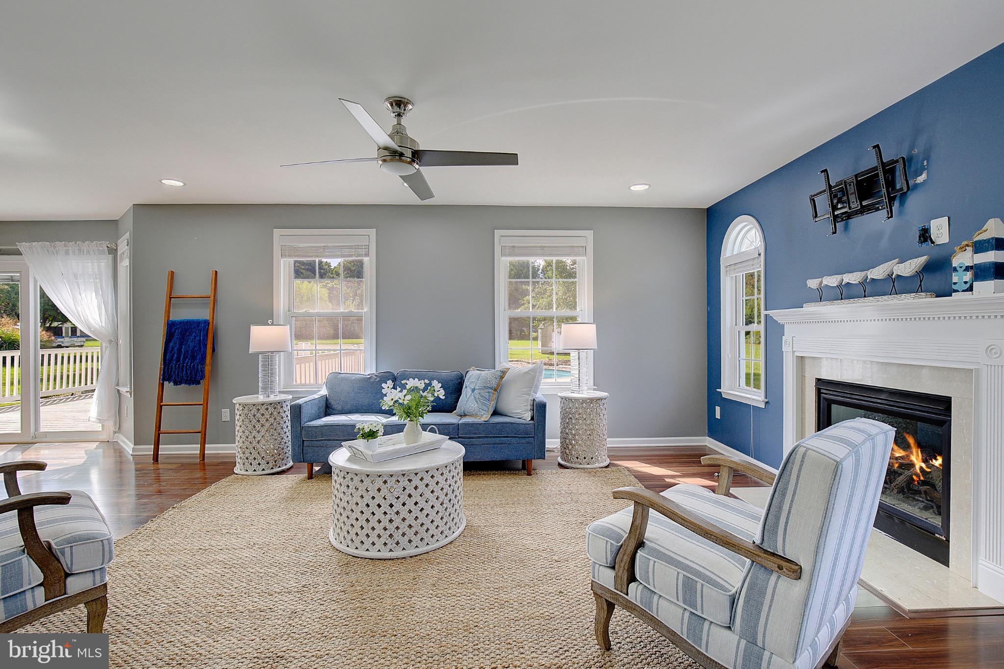 123 Bentons Pleasure Road Chester, MD 21619 - Photo 13 of 63 a living room with furniture and a fireplace