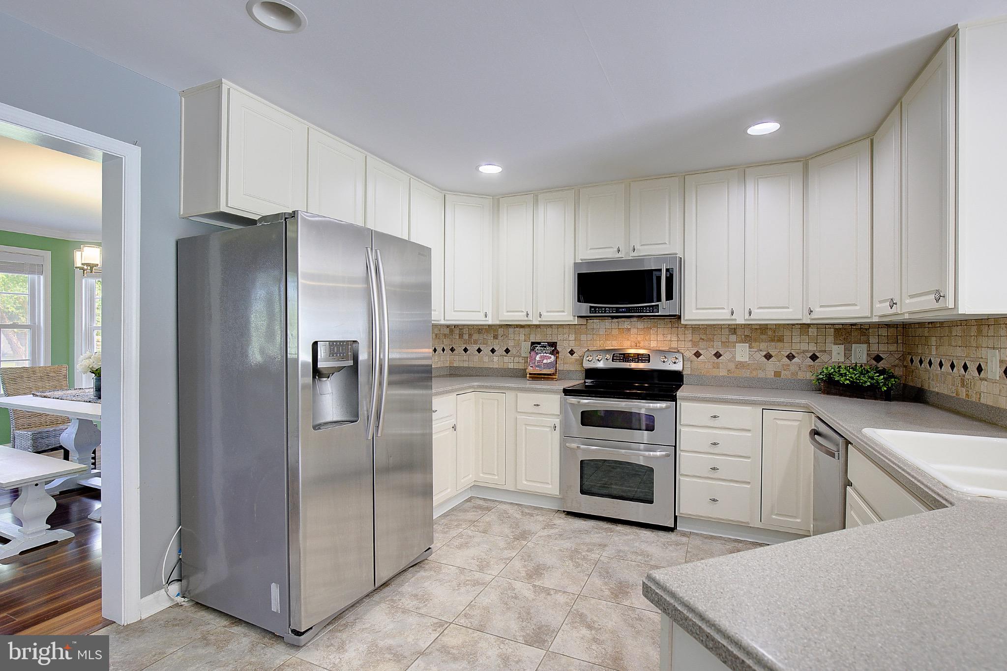 123 Bentons Pleasure Road Chester, MD 21619 - Photo 21 of 63 Modern kitchen with sleek appliances.