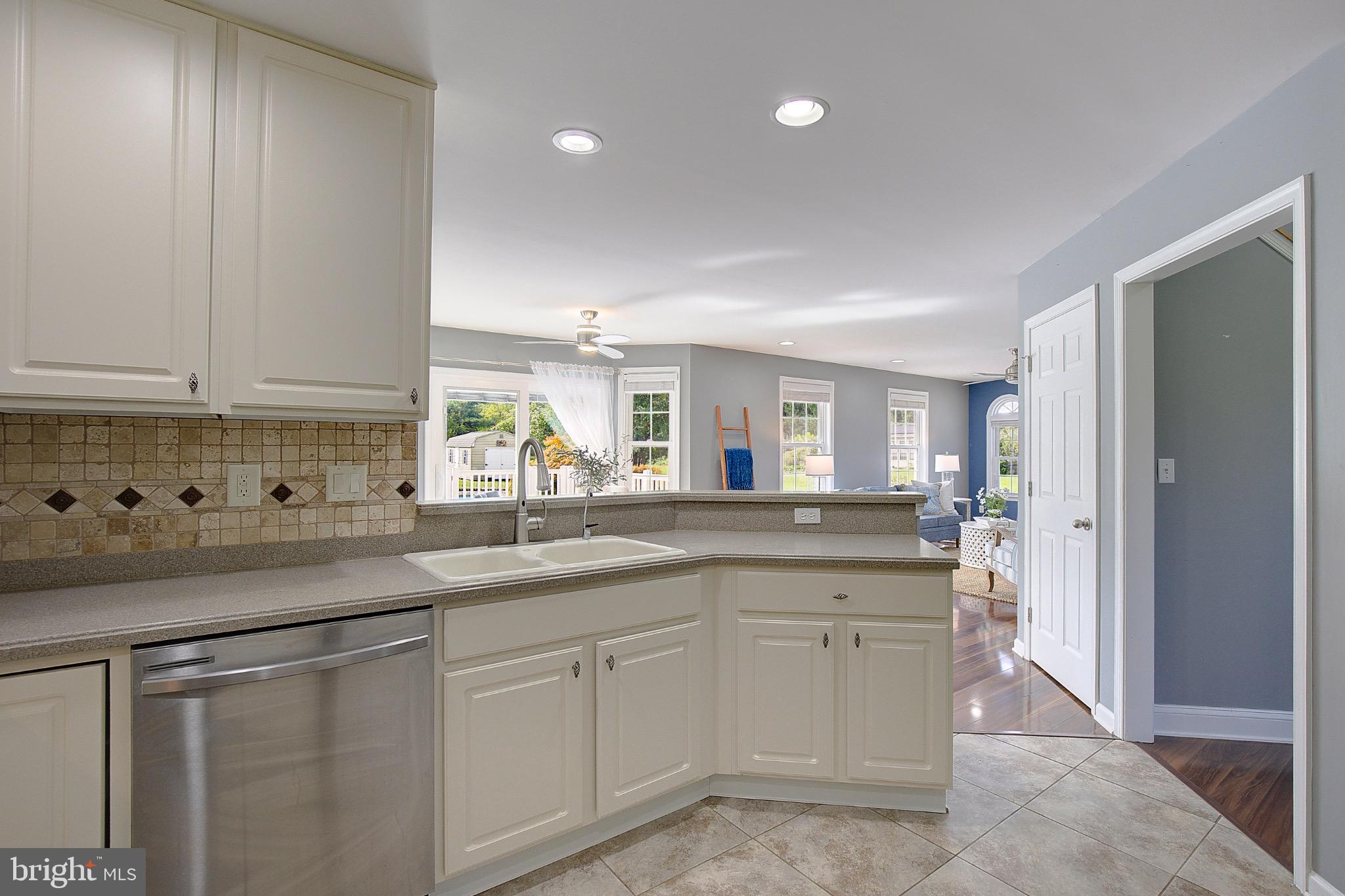 123 Bentons Pleasure Road Chester, MD 21619 - Photo 23 of 63 a kitchen with stainless steel appliances granite countertop a sink and cabinets