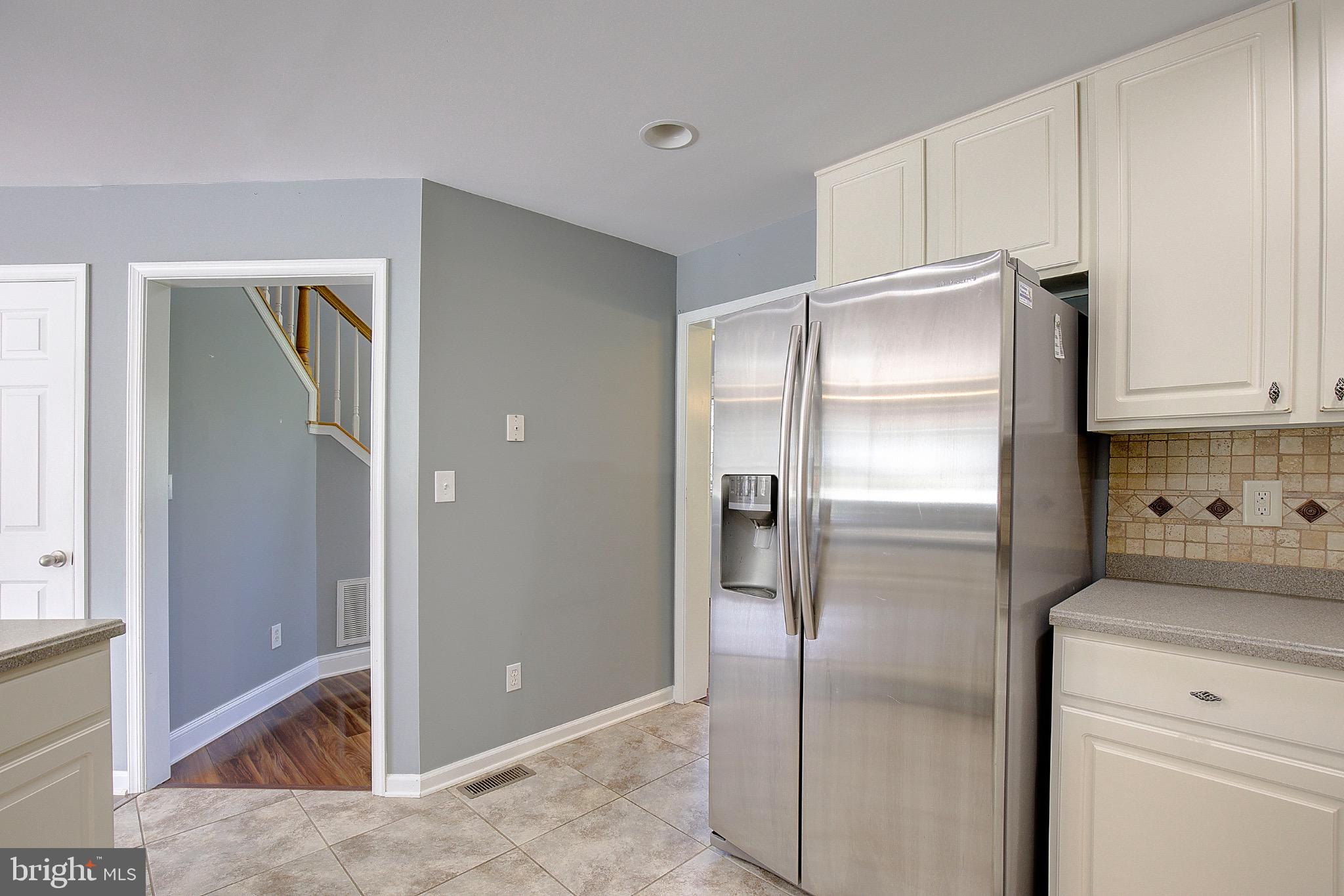 123 Bentons Pleasure Road Chester, MD 21619 - Photo 24 of 63 a kitchen with a refrigerator and a sink