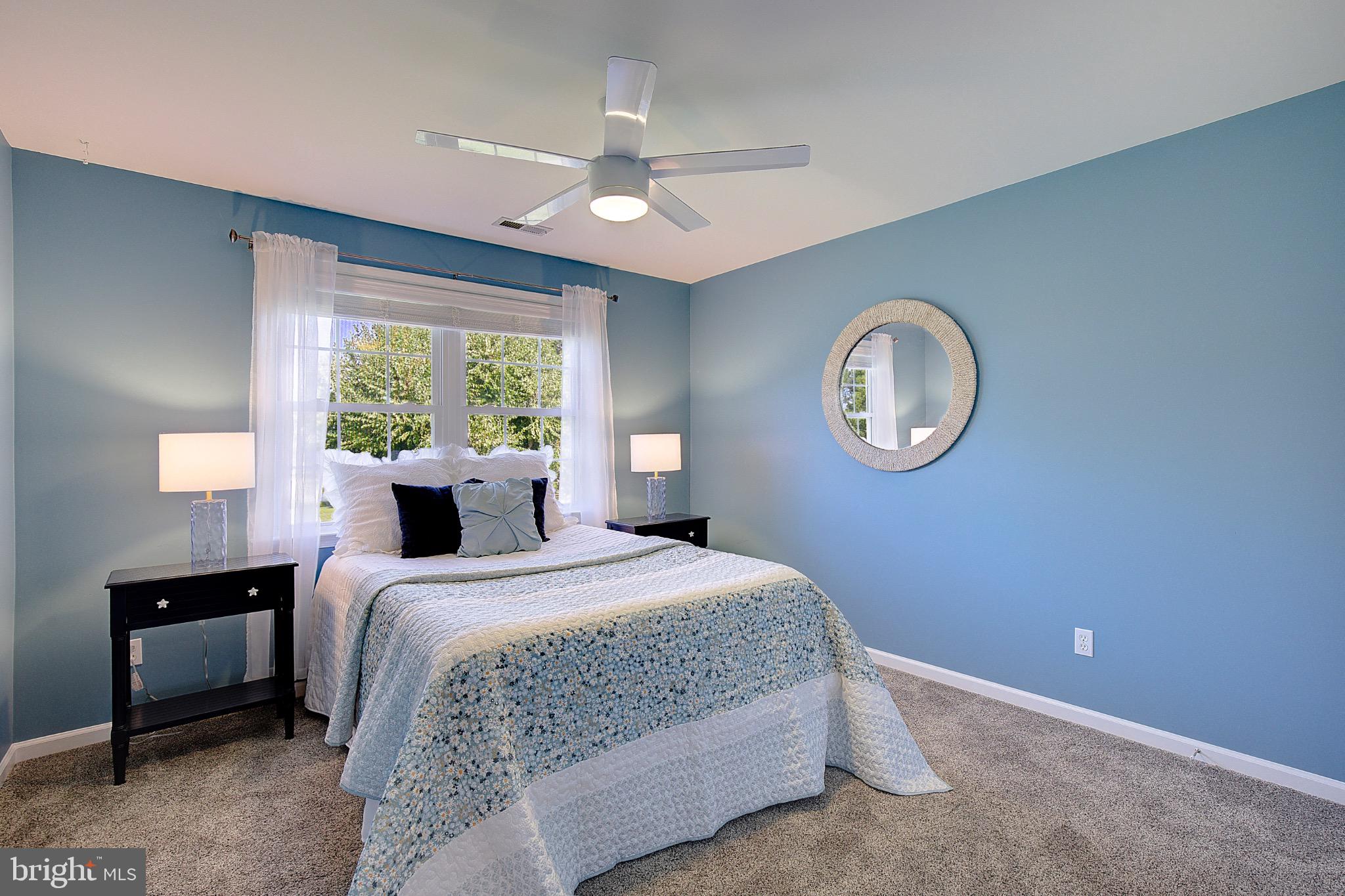 123 Bentons Pleasure Road Chester, MD 21619 - Photo 28 of 63 a bedroom with a large bed and a large window